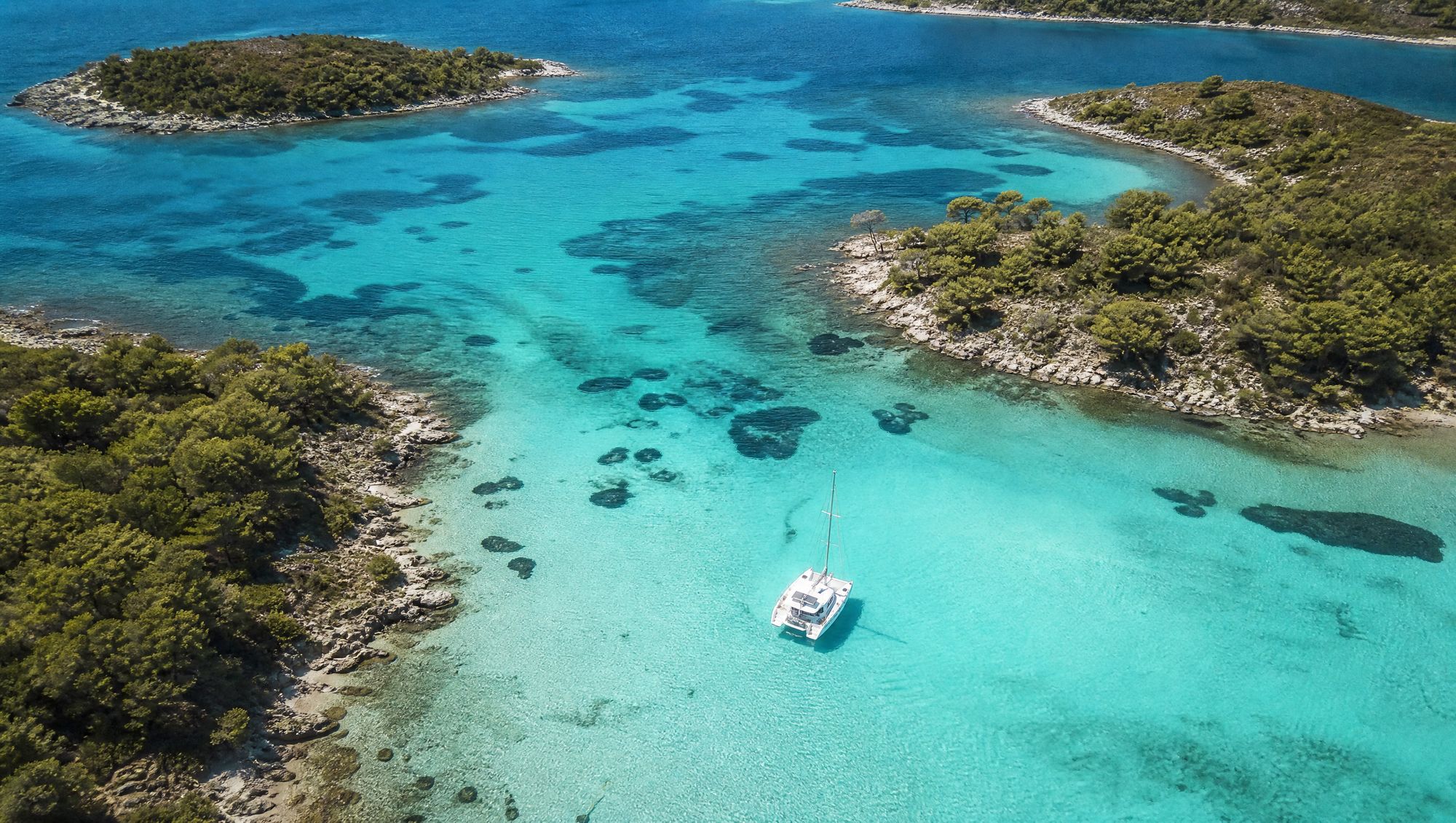 Turquoise lagoon of Diaporos island from above