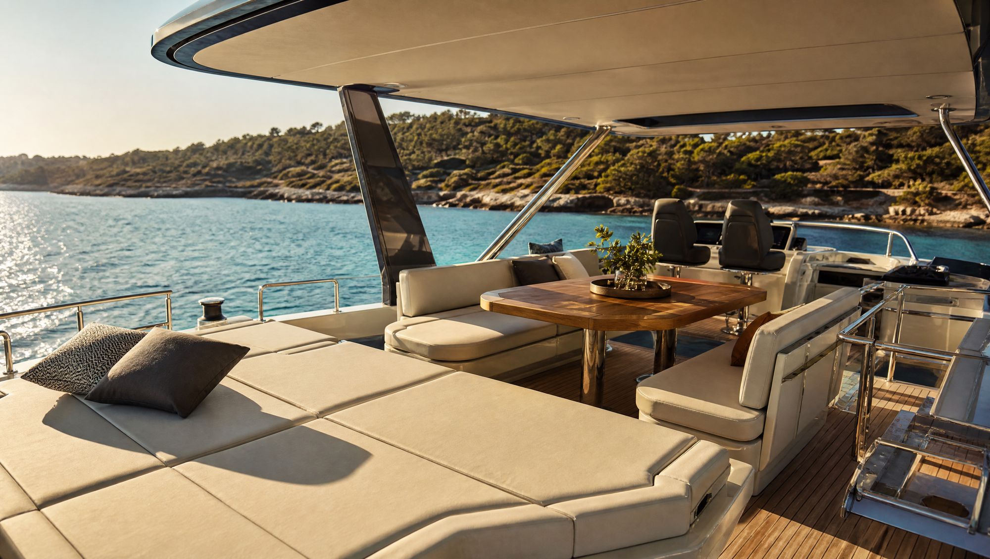 Flybridge with sun pads and shaded dinette